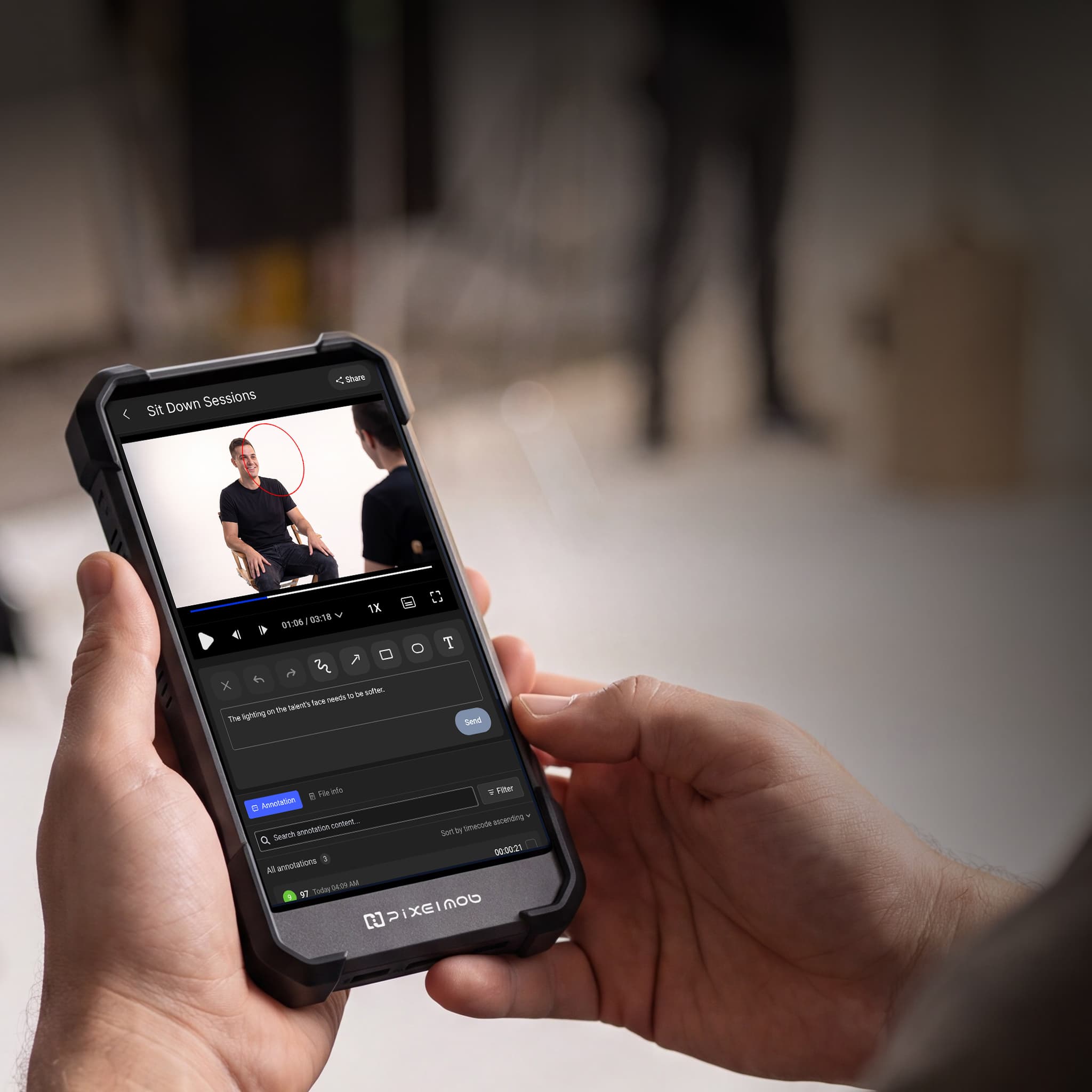 A creator reviewing and annotating footage on a PixelMob device